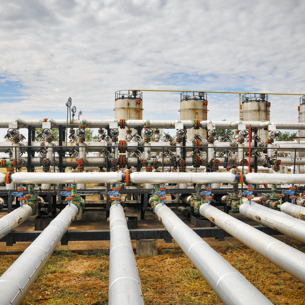 complex network of silver gas or oil pipelines and valves outdoors complex network of silver gas or oil pipelines and valves outdoors